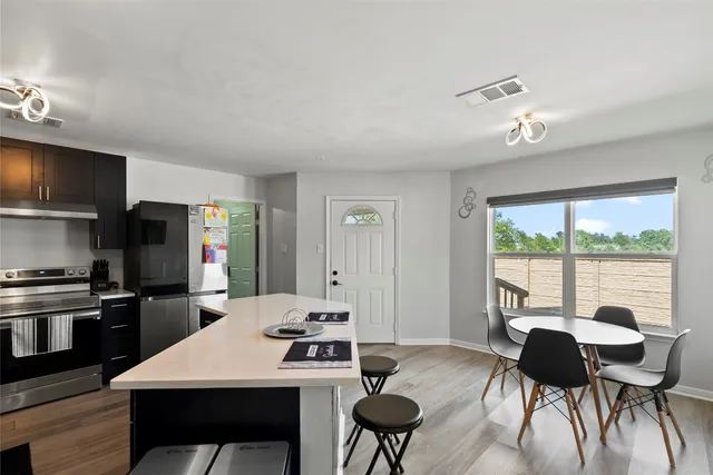 a view of a dining room with furniture window and outside view