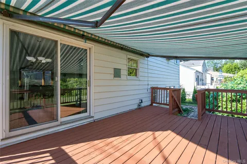 a view of a two chairs in the balcony