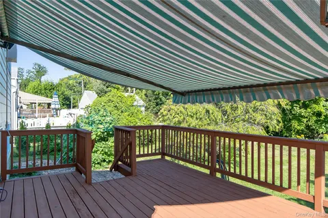 a view of a backyard with wooden floor