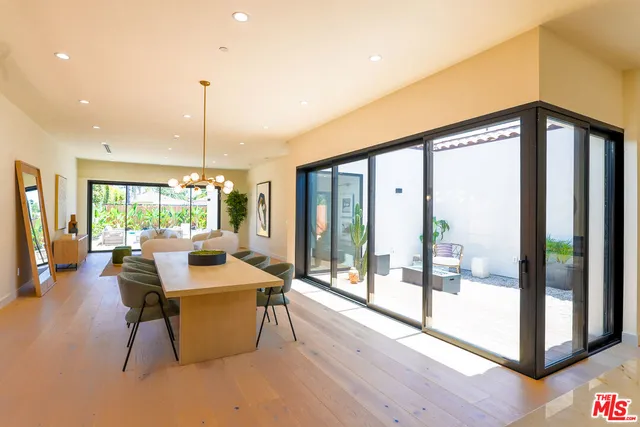 a living room with furniture and flowers