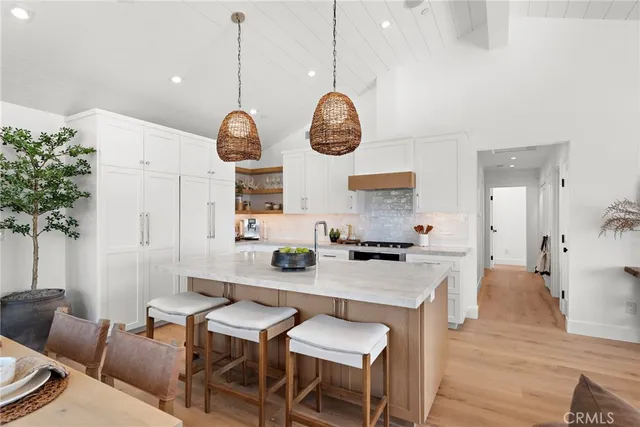 a very nice looking dining room with a table and chairs