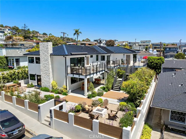 an aerial view of residential houses and city street