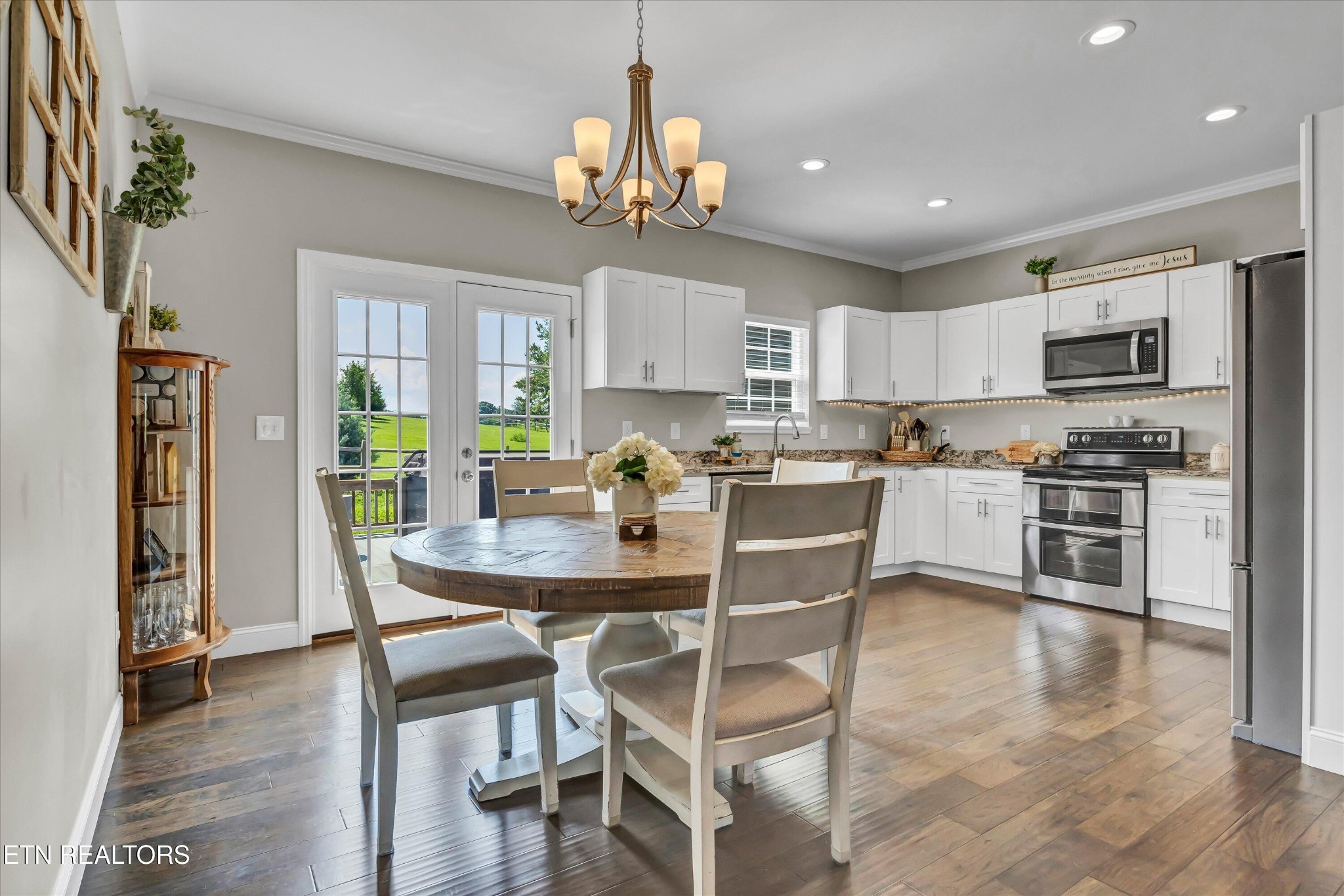 4806 Salem Road Greenback, TN 37742 - Photo 7 of 31 a kitchen with kitchen island granite countertop a dining table chairs stainless steel appliances and cabinets