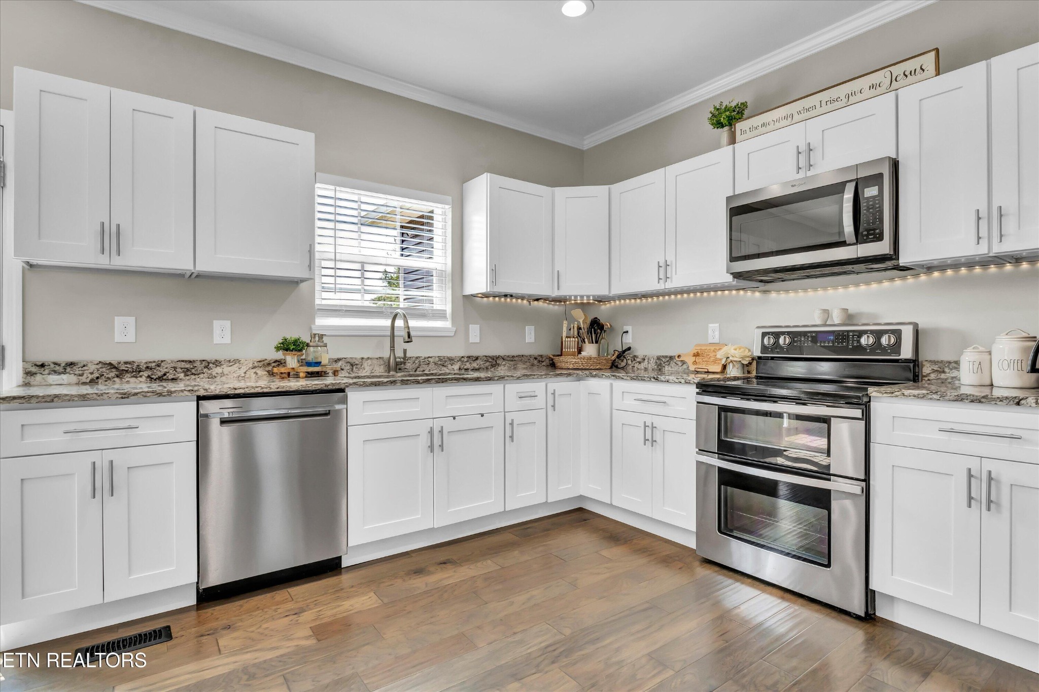 4806 Salem Road Greenback, TN 37742 - Photo 8 of 31 a kitchen with granite countertop white cabinets and stainless steel appliances