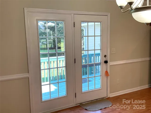 a view of an empty room with windows