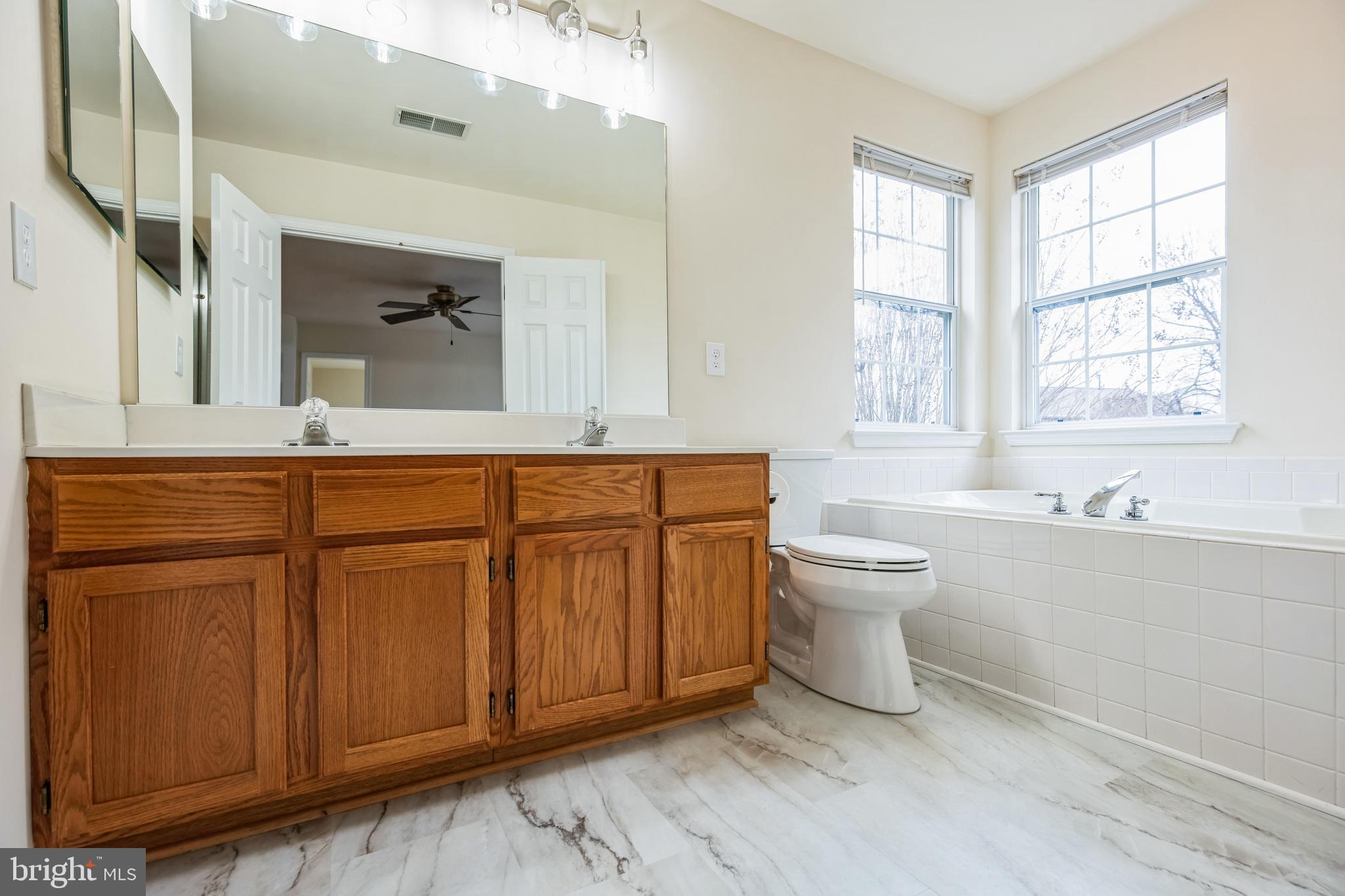 1557 Chapman Road Crofton, MD 21114 - Photo 22 of 39 Primary bath w/new floor and toilet.