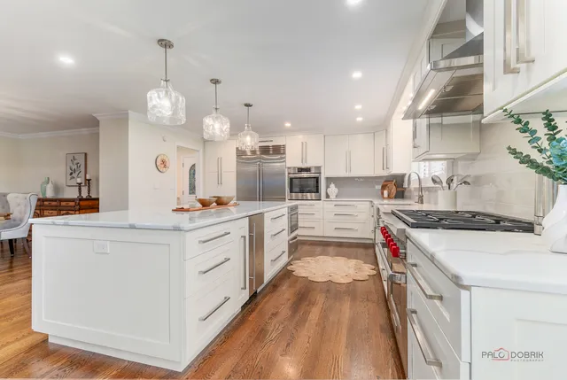 a kitchen with a stove a sink and a refrigerator