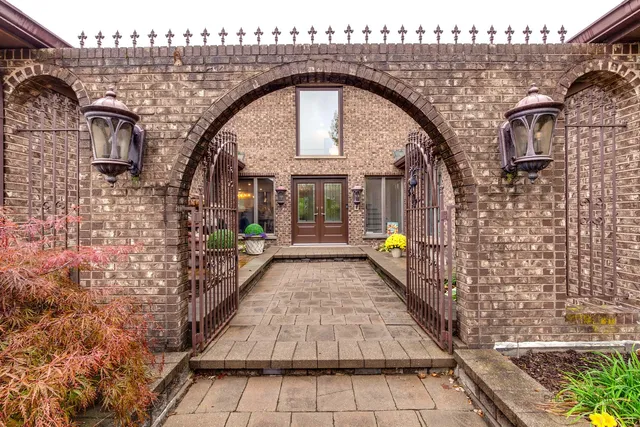 a view of entryway with brick walls