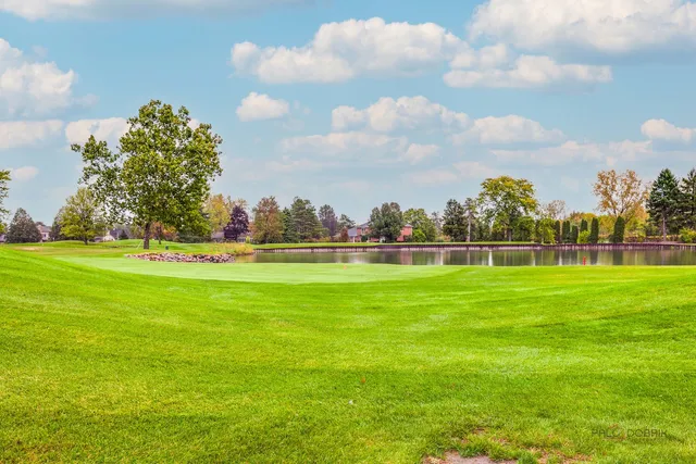 a view of a golf course with a lake