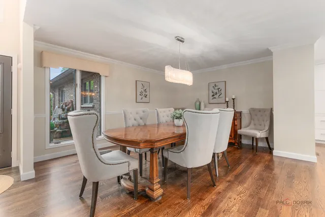a view of a dining room with furniture and wooden floor