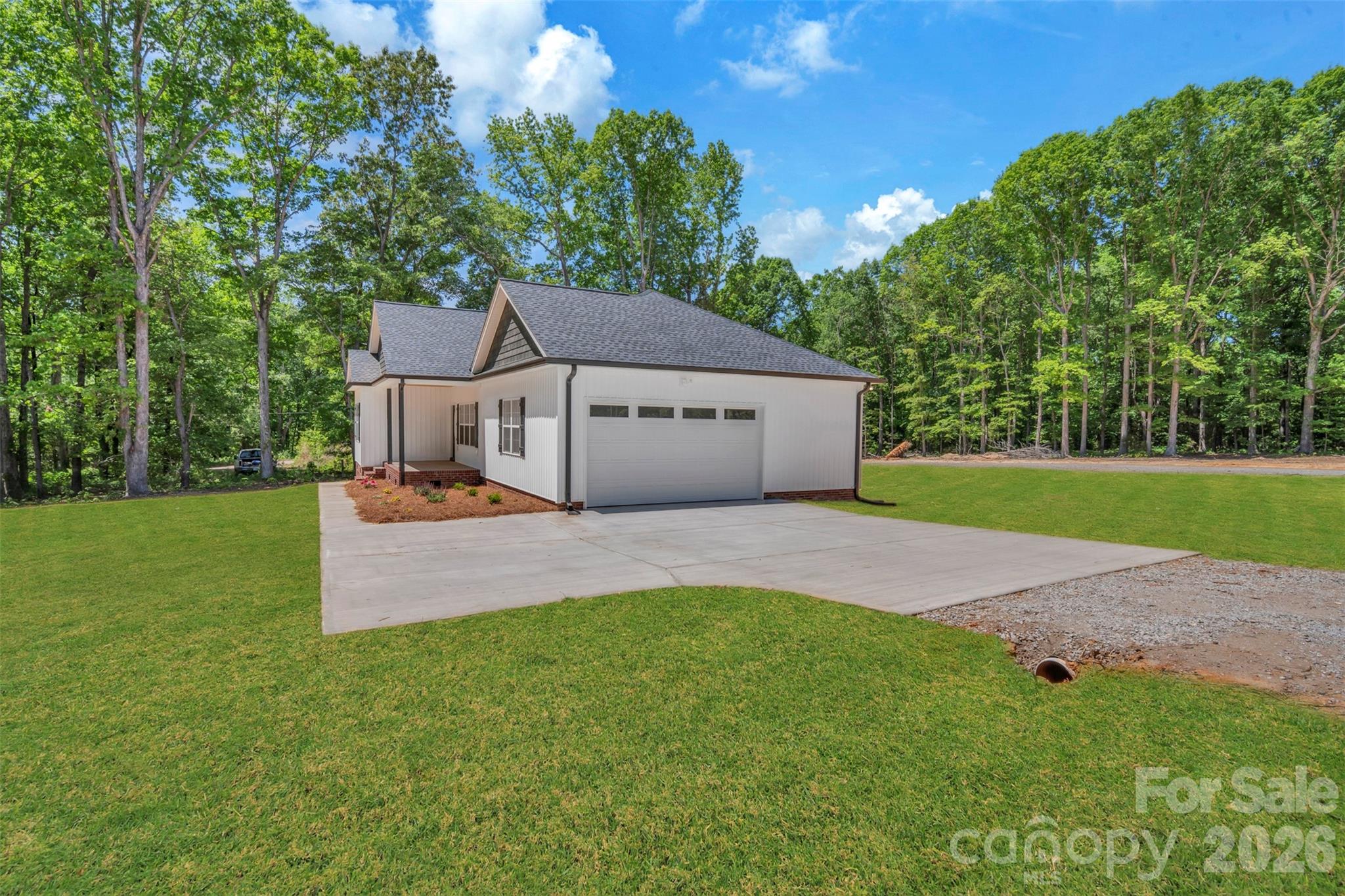 0 Cimmeron Road Lancaster, SC 29720 - Photo 3 of 29 a front view of a house with a garden