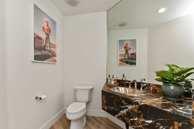 a bedroom with a bed and a couch