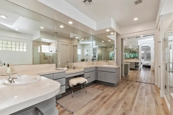 a bathroom with a tub sink shower and view
