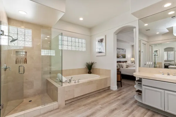 a front view of a house with a flower garden