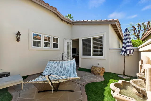 a livingroom with workspace and a window