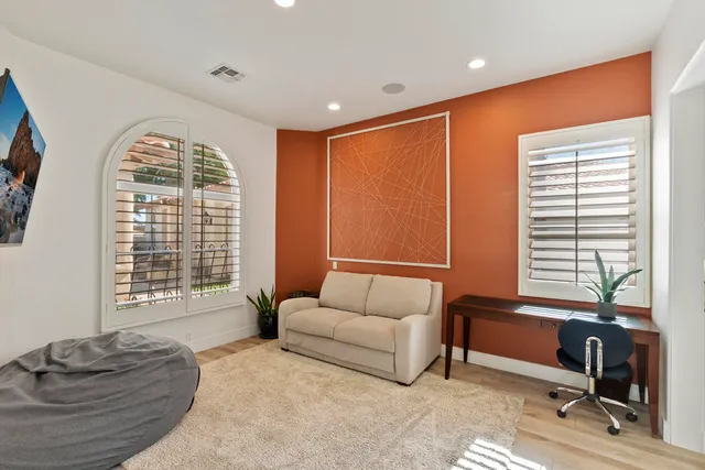 a bathroom with a shower sink and mirror