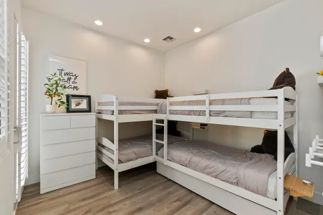 a view of a chairs and table in patio with a lake view