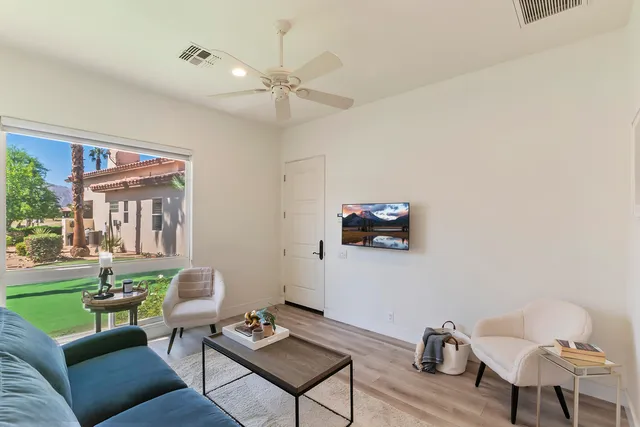 a view of a patio with couches and potted plants