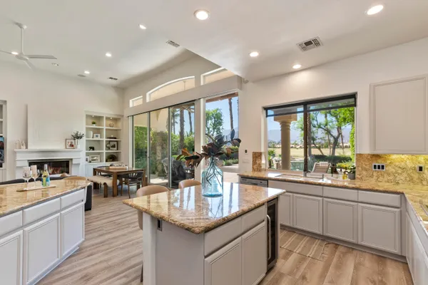 a kitchen with center island and windows