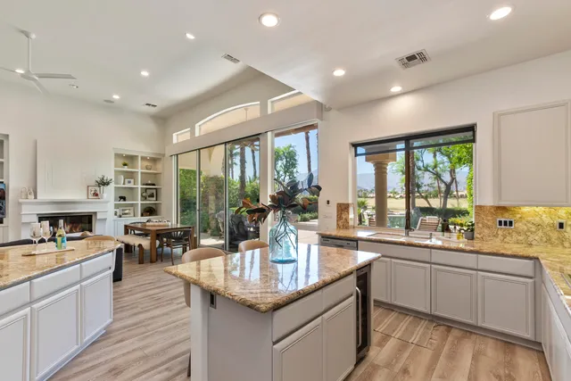 a kitchen with center island and windows