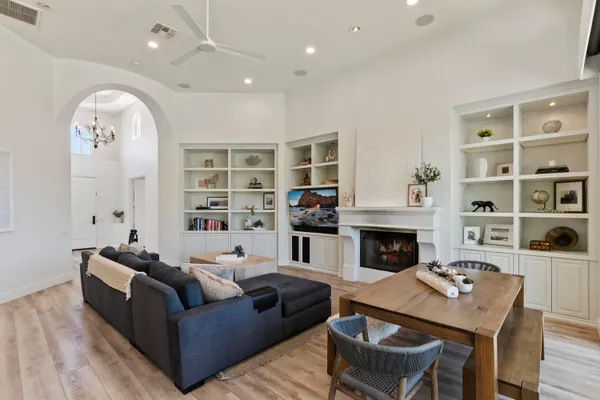 a living room with furniture and a fireplace