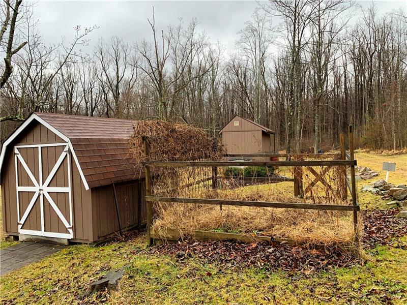 466 Powder Mill Road Rector, PA 15677 - Photo 20 of 25 The first shed holds equipment for yard care; the 2nd is the pool shed with pump. Note the garden area is fenced to help protect the harvest from the deer!