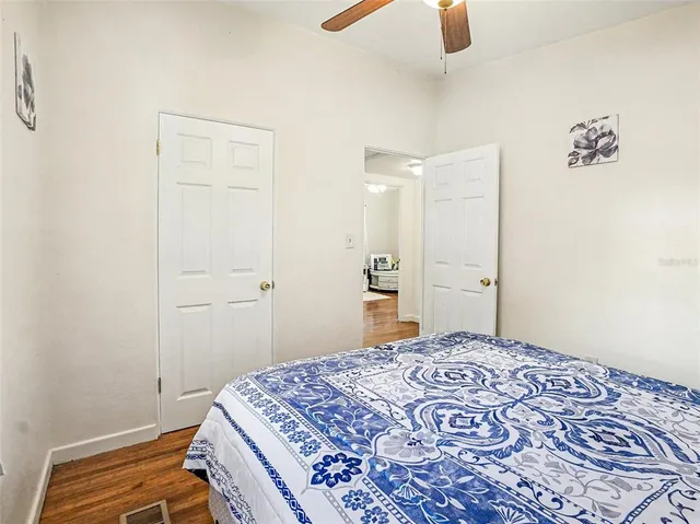 a bedroom with a bed and a dresser