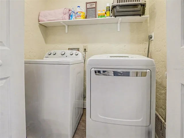 a utility room with dryer and washer