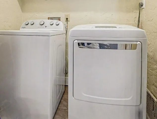 a utility room with dryer and washer