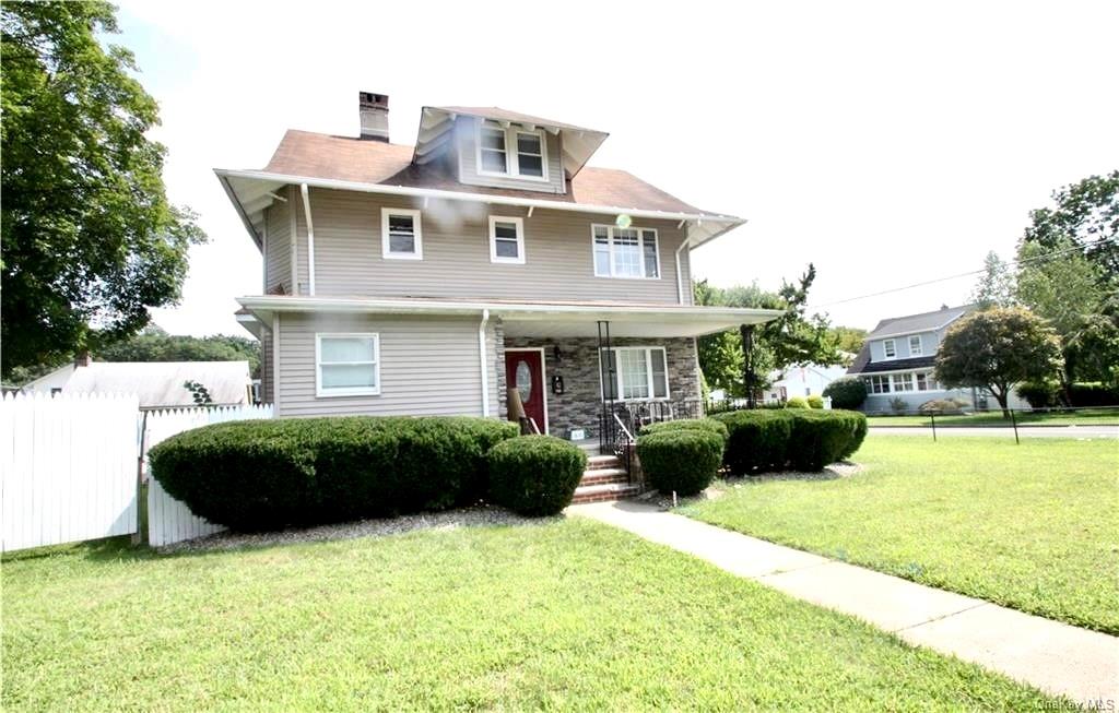 42 Boulevard Suffern, NY 10901 - Photo 1 of 1 a front view of a house with a yard and potted plants