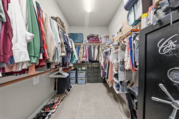 a front view of a house with a garden and yard