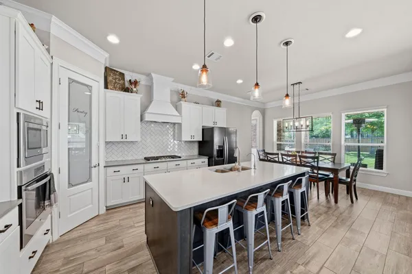 a view of walk in closet with clothes