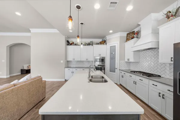 a white refrigerator freezer sitting inside of a kitchen