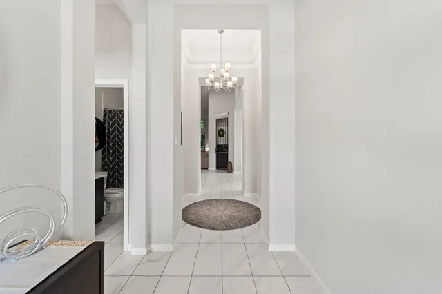 a large bed sitting in a bedroom next to a window