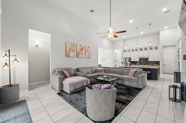 a living room with furniture and a large window