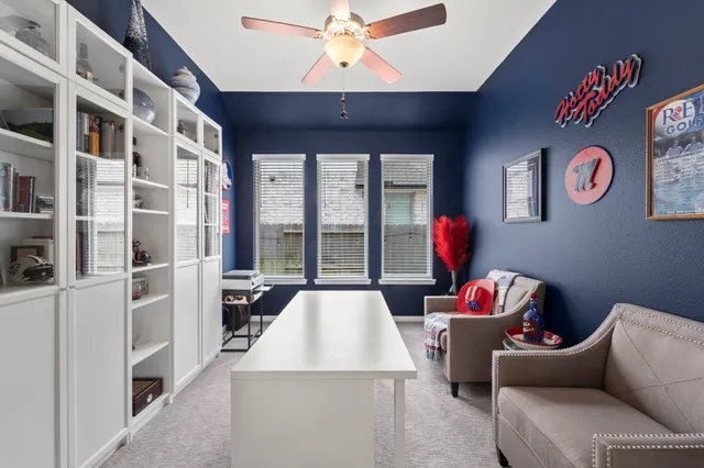 a room with pool table and a chandelier