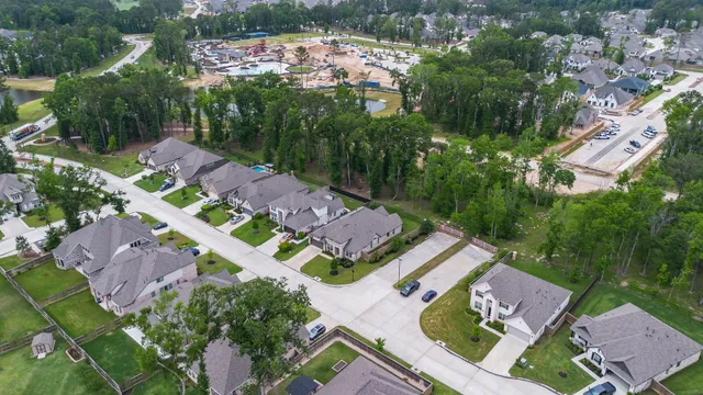 a front view of a house with yard and green space