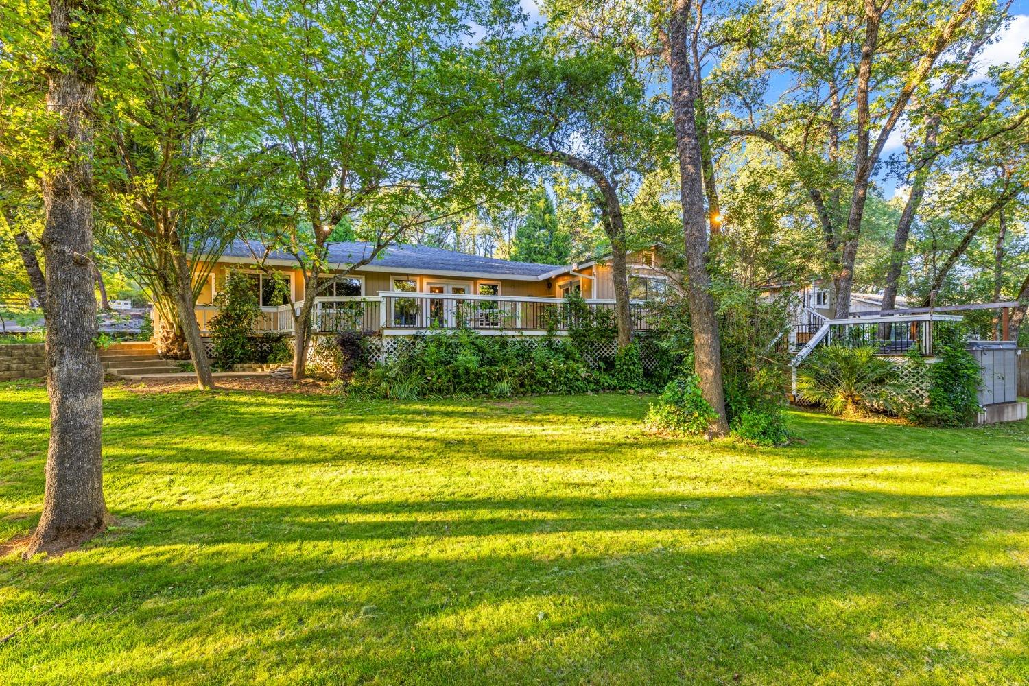 4115 Badger Lane Placerville, CA 95667 - Photo 1 of 1 a view of a house with a big yard and large trees