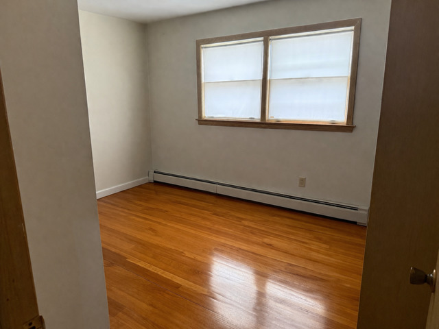 8304 W Forest, Unit 3W Chicago, IL 60634 - Photo 6 of 8 an empty room with a window