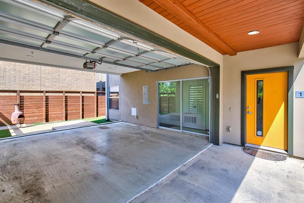 5205 Capitol Avenue, Unit 1 Dallas, TX 75206 - Photo 14 of 39 a view of an empty room with a fireplace and a window