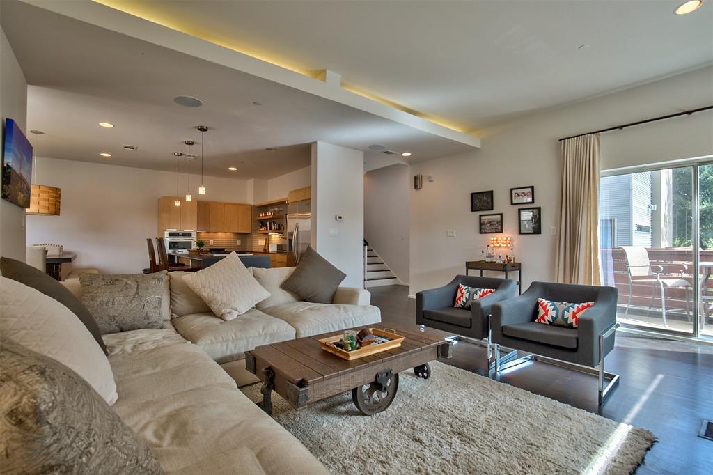 5205 Capitol Avenue, Unit 1 Dallas, TX 75206 - Photo 2 of 39 a living room with furniture kitchen view and a table