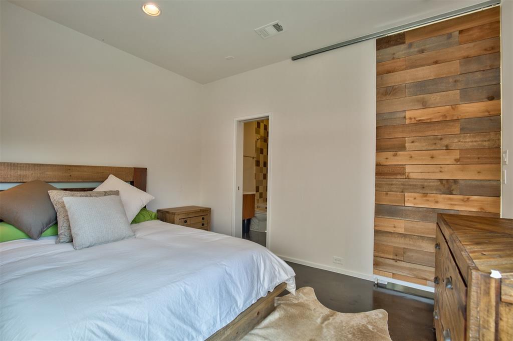 5205 Capitol Avenue, Unit 1 Dallas, TX 75206 - Photo 21 of 39 a bedroom with a bed and a shower
