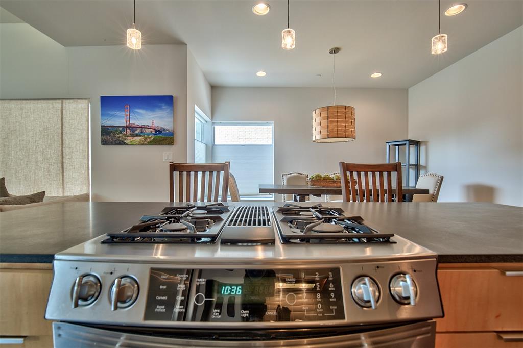 5205 Capitol Avenue, Unit 1 Dallas, TX 75206 - Photo 25 of 39 a stove top oven sitting inside of a kitchen