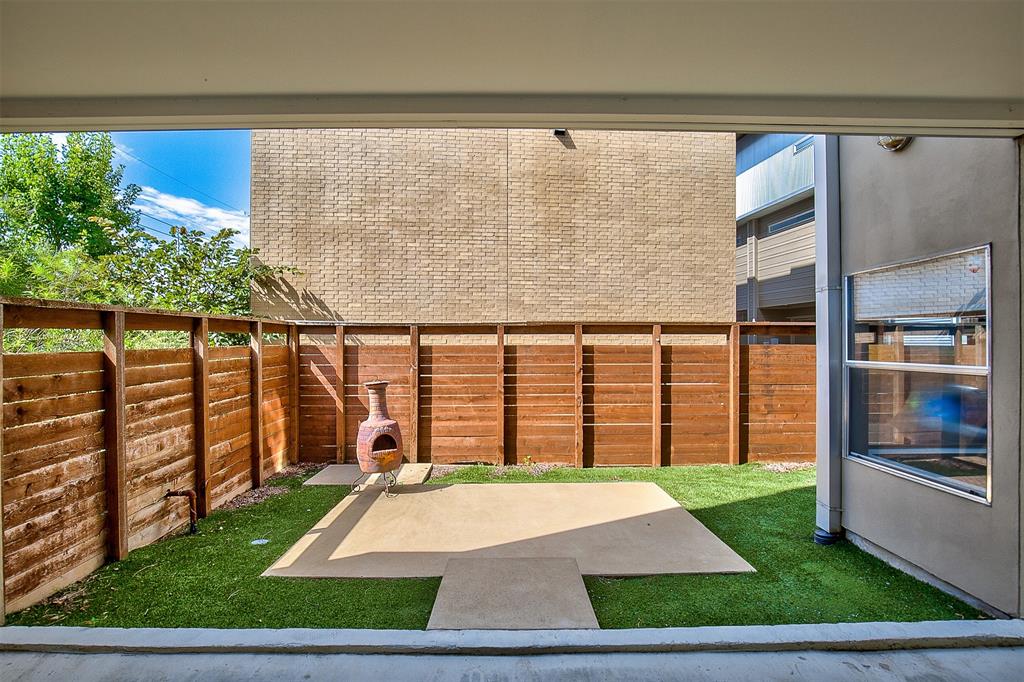 5205 Capitol Avenue, Unit 1 Dallas, TX 75206 - Photo 29 of 39 a view of a porch with a floor to ceiling window and a yard