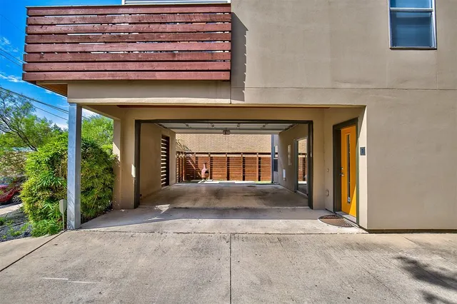 a view of a porch with a floor to ceiling window and a yard