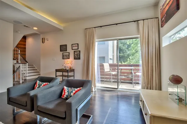 a living room with furniture and a table