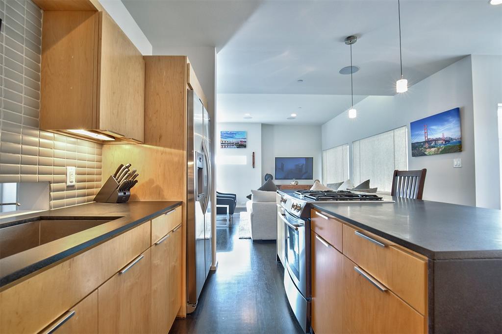 5205 Capitol Avenue, Unit 1 Dallas, TX 75206 - Photo 8 of 39 a kitchen with stainless steel appliances granite countertop a sink a stove and a refrigerator