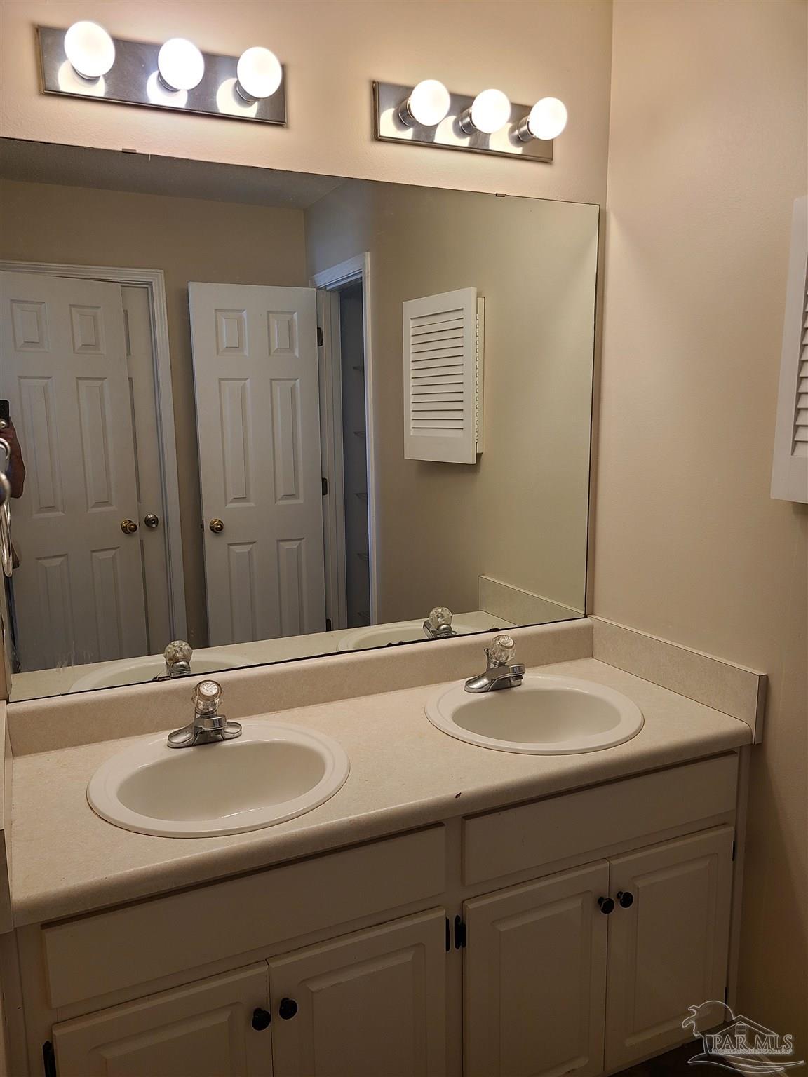 137 Mirabelle Circle Pensacola, FL 32514 - Photo 13 of 21 a bathroom with a sink a light fixture and a mirror