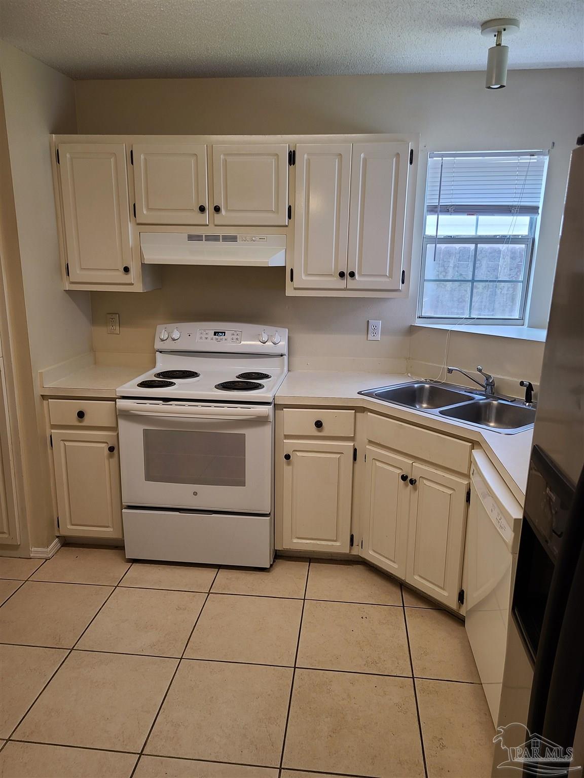 137 Mirabelle Circle Pensacola, FL 32514 - Photo 6 of 21 a kitchen with white cabinets appliances and a sink