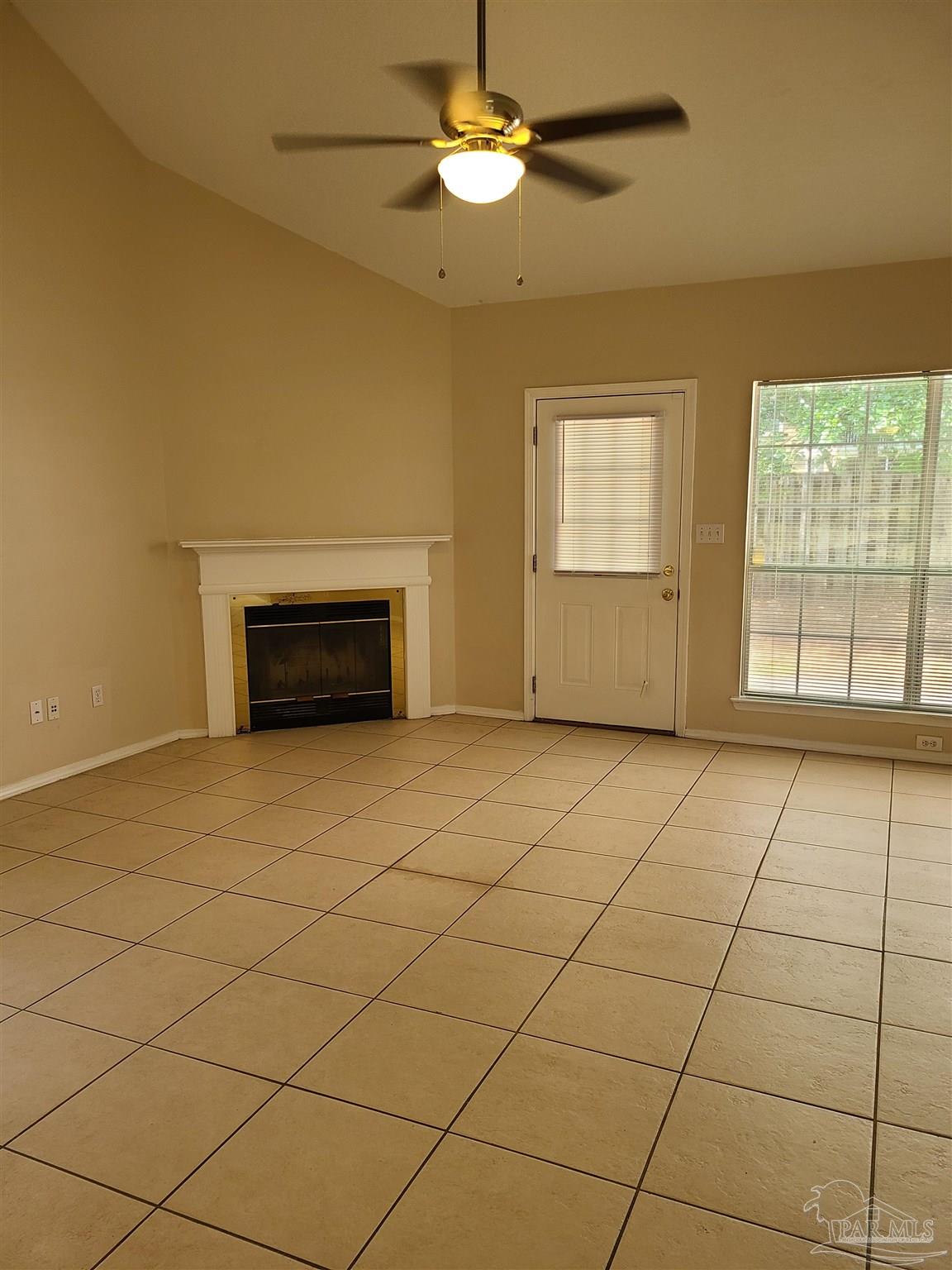 137 Mirabelle Circle Pensacola, FL 32514 - Photo 8 of 21 a view of an empty room with a fireplace and a window